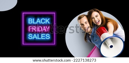 Happy excited couple with megaphone and shopping bags. Man and woman shout saying in loudspeaker mega phone. Big deals, discounts offers concept. Black Friday sales neon light sign. Grey back.