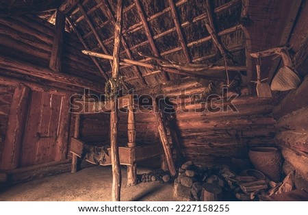 Slavic and Viking village of Wollin. Old wooden and fisherman's hut. Close-up of an old house in the Middle Ages. Old fisherman's hut and wooden hut with spices and pots. evil Dead Royalty-Free Stock Photo #2227158255