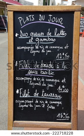 Sign with French text: dishes of the day starting at 12,50 euro