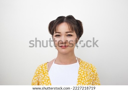 Female mugshot picture for passport. Creative person photographing for document. Visa picture. Serious portrait of smiling person for papers. Film grain pixel texture. Blur. Soft focus.