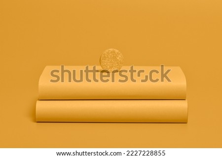 Yellow effervescent tablet isolated on yellow background