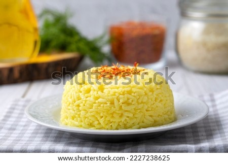 A plate of saffron rice pilaf (Turkish name; safranli pilav) Royalty-Free Stock Photo #2227238625