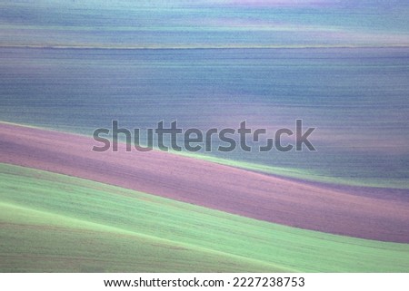 Abstract detail of layers of colourful pastel bands of soil in the agriculture farmland of South Moravia in the Czech Republic. Royalty-Free Stock Photo #2227238753