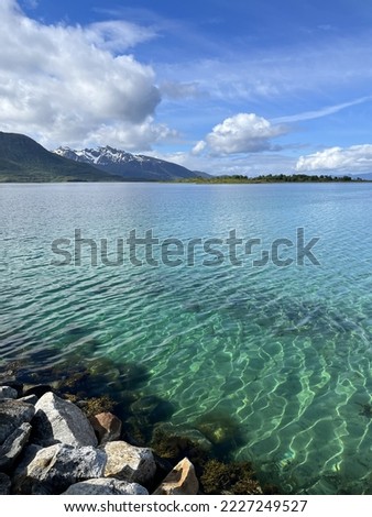 azure transparent sea water, sea view with mountains background