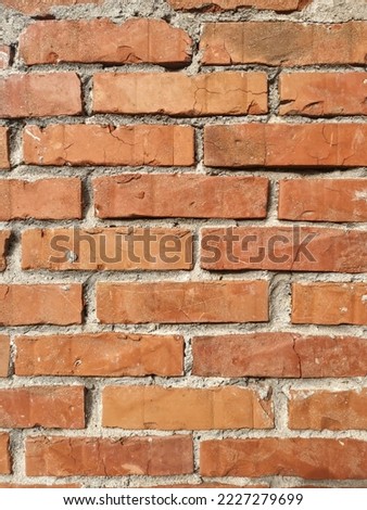 The wall made of an old brown bricks