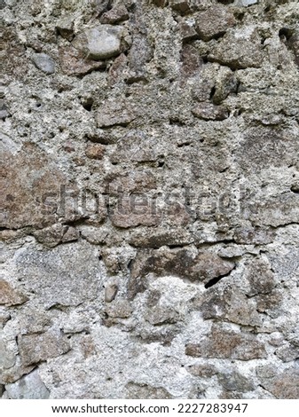 Texture of grunge rough wall with rocks