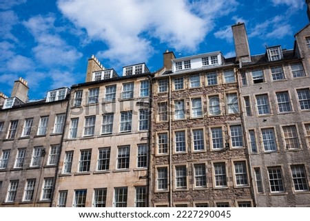 Edinburgh's architecture is immediately recognisable, pictured here row homes near the Royal Mile during a sunny day. 