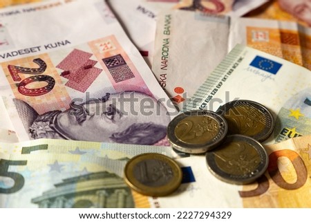 Croatia joins the eurozone.
Croatian banknotes and European banknotes (Kuna and Euro). Royalty-Free Stock Photo #2227294329
