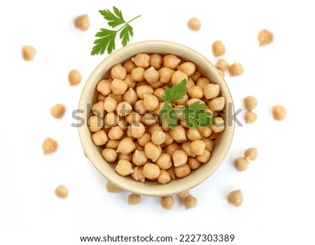 Ceramic bowl full of boiled chickpeas isolated on white background Royalty-Free Stock Photo #2227303389