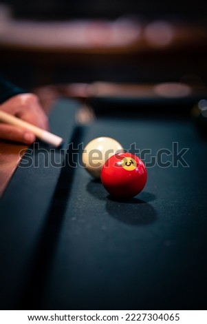 Just a simple game of billiards with a girl playing. Royalty-Free Stock Photo #2227304065
