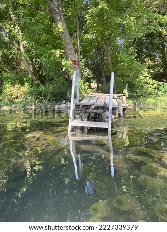Picture of a dock near a beautiful springs river