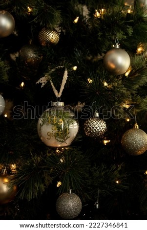 christmas tree with decorations ball and ultrasound picture in it . High quality photo