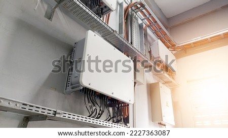 Instalation control of  inverters solar panel on the wall. Technology of solar energy with shiny light. Royalty-Free Stock Photo #2227363087