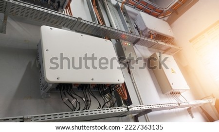 Instalation control of  inverters solar panel on the wall. Technology of solar energy with shiny light. Royalty-Free Stock Photo #2227363135