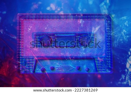 Retro audio compact cassette tape for recorder or player in bright acid neon colors. Vintage Style 80-90s. Template for music album cover, flyer, magazine, leaflet. Nostalgic memories of old school.