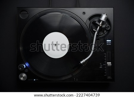 Dj turntable in flat lay. Professional hi fi turn table player for disc jockey shot directly from above Royalty-Free Stock Photo #2227404739
