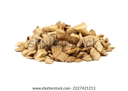 Wood chips for smocking isolated on white background. Natural apricot wood smoking chunks Royalty-Free Stock Photo #2227421213