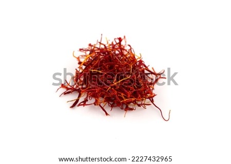 Dried saffron spice pieces isolated on a white background