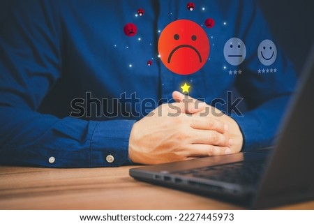 Unhappy man customer with sad emotion face on laptop. Bad review and service dislike poor quality, low rating, bad social media not good. Customer experience dissatisfied and testimonial concept. Royalty-Free Stock Photo #2227445973