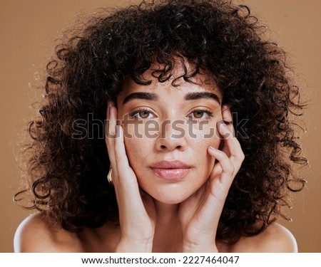 Woman, hands on face and afro hair care for beauty wellness in studio. Skincare dermatology wellness, African girl model portrait and cosmetics makeup headshot for healthy natural skin or facial care Royalty-Free Stock Photo #2227464047
