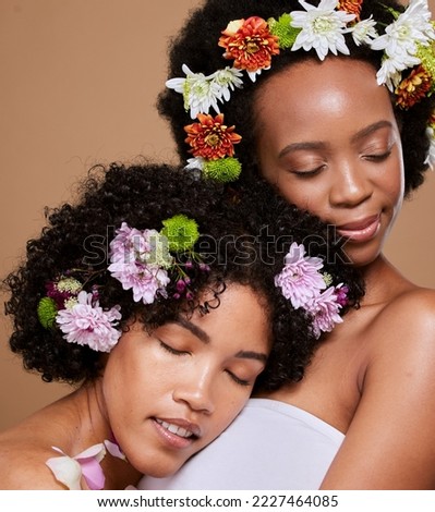 Black women, flowers and skincare of beauty, wellness and skin glow of friends support and treatment. Calm black woman with natural, cosmetics and hair care with flower, organic and plant health