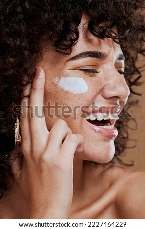Happy woman, face cream and beauty, makeup product and sunscreen facial treatment for aesthetic shine. Young model, face freckles and body lotion, cosmetics and healthy skincare, wellness and melasma Royalty-Free Stock Photo #2227464229