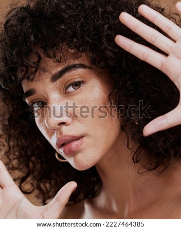 Frame, woman and face portrait for beauty, skincare and health or wellness of a latino female. Hand, gesture and skin care, facial health or wellbeing of a hispanic girl with smooth, soft skin