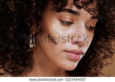 Woman, beauty and face with makeup and foundation for cosmetics and skintone shade. Cosmetic, beauty face and latino female with colour swatches on her skin for concealer product for cosmotology.