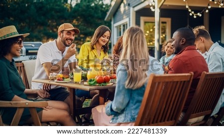 Family and Multiethnic Diverse Friends Gathering Together at a Garden Table. People Eating Grilled and Fresh Vegetables, Sharing Tasty Salads for a Big Family Celebration with Relatives.