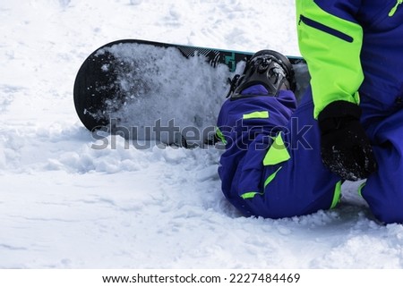 Snowboarder's feet on the mountain holidays. High quality photo