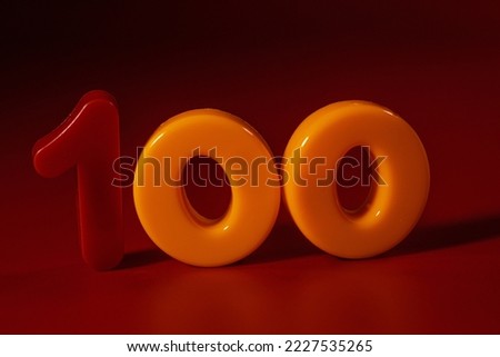 The number 100 is placed on a red background. Anniversary number.