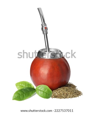 Calabash with mate tea, bombilla and green leaves on white background Royalty-Free Stock Photo #2227537011