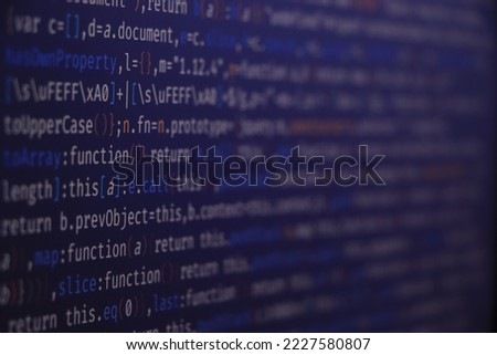 Programming code on black background. It is HTML and javascript code with highlighted scripts and functions. Script on computer with source code – screen of software developer. Javascript code.
