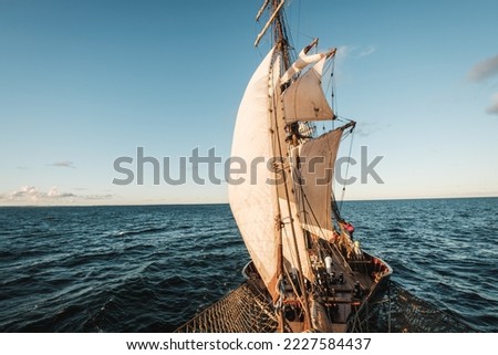 Sunset picture of an adventure on an old sailing vessel