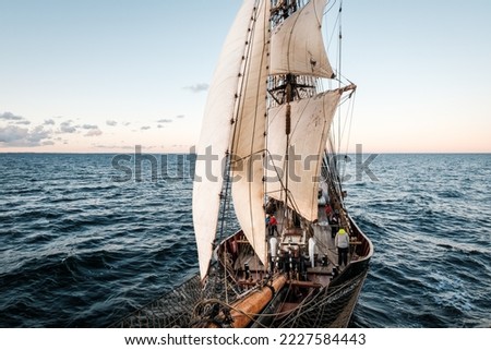 Sunset picture of an adventure on an old sailing vessel