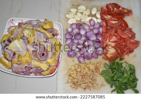 ingredients for country chicken gravy fry recipe raw meat chopped onion tomato chilli garlic ginger