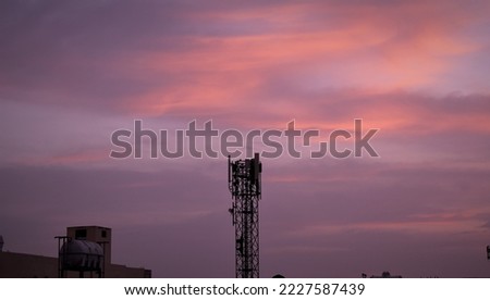 Beautiful sky from my rooftop during sunrise. Wanted to take a good picture with a cell tower in focus.