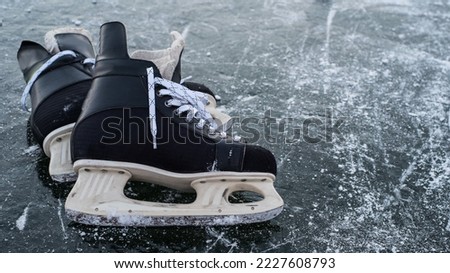 hockey scates on ice pond riwer