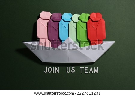 Many colorful paper figures in boat and phrase Join Us Team on green background, flat lay. Recruiter searching employee