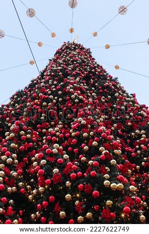 Decorated Christmas tree with red balls and garlands