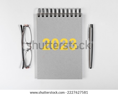2023 new year planning on planner, diary, pen and glasses. High quality photo