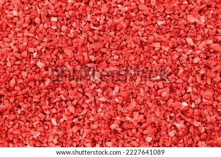 Strawberry food background. Strawberries texture. dehydrated, dried Strawberry pieces, coarse cuts, chips. Heap of freeze dried strawberries. sweet fruit background. Red background stock image.