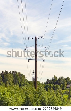 power line poles on a blue sky background