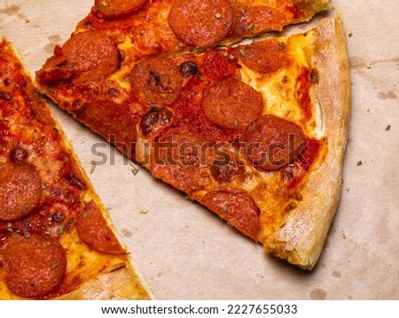 pepperoni pizza slices in a paper box