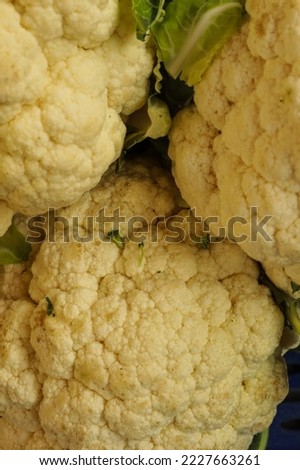 A closeup shot of fresh and raw cauliflower stock on the boat for sell