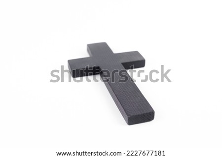 Wooden cross of Jesus. On a white background.