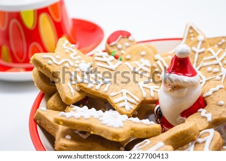 Tasty Christmas gingerbread cookies in cookie jar on white background. take detail 2