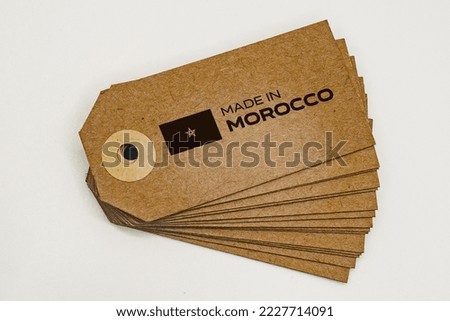 Bunch of cardboard labels with 'Made In Morocco' inscription and flag.