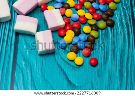 Pink marshmallows and colorful candies