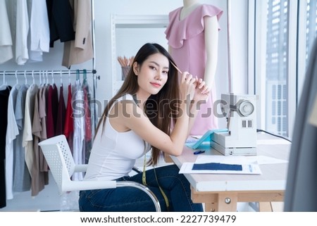 asian female designer working at studio
